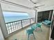 Balcony with ocean view and outdoor furniture, ideal for relaxing and enjoying the scenery at 9500 Shore Dr. # 17B, Myrtle Beach, SC 29572