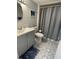 Standard bathroom with a sink vanity, toilet, and shower with a curtain at 9500 Shore Dr. # 17B, Myrtle Beach, SC 29572