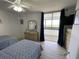 Bedroom with two twin beds, ceiling fan, dresser, and sliding glass doors to balcony at 9500 Shore Dr. # 17B, Myrtle Beach, SC 29572