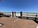 Beach access wooden deck features rinse stations, benches, and views to the ocean at 9500 Shore Dr. # 17B, Myrtle Beach, SC 29572