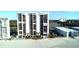 Exterior high-rise condo building featuring a pool, landscaping, and beach access at 9500 Shore Dr. # 17B, Myrtle Beach, SC 29572