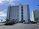 Beautiful beachfront condo building with a view of the parking lot and easy access to the beach at 9500 Shore Dr. # 17B, Myrtle Beach, SC 29572