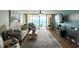 Bright living room with ocean view, comfortable seating, and stylish decor leads to outdoor balcony at 9500 Shore Dr. # 17B, Myrtle Beach, SC 29572