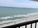 Breathtaking ocean view from the balcony, with white sand beaches and gentle waves at 9500 Shore Dr. # 17B, Myrtle Beach, SC 29572