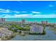 Majestic aerial view displaying the luxurious buildings next to the ocean and golf course at 9551 Edgerton Dr. # C-6, Myrtle Beach, SC 29572