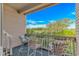 Charming balcony with comfortable seating and scenic views of lush greenery, creating a perfect relaxation spot at 9551 Edgerton Dr. # C-6, Myrtle Beach, SC 29572