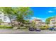 Charming condo building with lush landscaping, private balconies, and convenient parking at 9551 Edgerton Dr. # C-6, Myrtle Beach, SC 29572