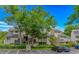 Inviting condo building with wood siding, manicured shrubbery, and a beautiful treeline at 9551 Edgerton Dr. # C-6, Myrtle Beach, SC 29572