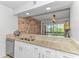 Modern kitchen features granite countertops, stainless steel appliances, and decorative backsplash at 9551 Edgerton Dr. # C-6, Myrtle Beach, SC 29572