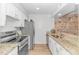 Well-equipped kitchen boasts granite countertops, stainless steel appliances, and ample storage space at 9551 Edgerton Dr. # C-6, Myrtle Beach, SC 29572