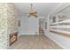 Spacious living room featuring a decorative brick fireplace, and hardwood flooring at 9551 Edgerton Dr. # C-6, Myrtle Beach, SC 29572