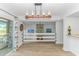 Inviting living space with access to a balcony, a white horizontal railing, and brick fireplace feature at 9551 Edgerton Dr. # C-6, Myrtle Beach, SC 29572