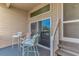 Cozy patio with chairs and a sliding glass door offers a relaxing outdoor space and easy access to the interior at 9551 Edgerton Dr. # C-6, Myrtle Beach, SC 29572