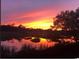 Beautiful sunset over the marsh with reflections, trees, and colorful sky at 9551 Edgerton Dr. # C-6, Myrtle Beach, SC 29572