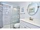 Bathroom featuring a tiled walk-in shower with glass door and modern sink at 9621 Shore Dr. # F-117, Myrtle Beach, SC 29572