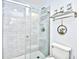 Bathroom with tiled shower, framed artwork and towel rack at 9621 Shore Dr. # F-117, Myrtle Beach, SC 29572