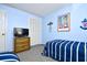 Guest bedroom with twin beds, closet space, and peaceful decor at 9621 Shore Dr. # F-117, Myrtle Beach, SC 29572
