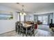 Cozy dining area flows into the living room with stylish furnishings and abundant natural light at 9621 Shore Dr. # F-117, Myrtle Beach, SC 29572