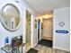 Inviting foyer with coastal decor, a decorative mirror, and access to various rooms in the home at 9621 Shore Dr. # F-117, Myrtle Beach, SC 29572