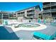 Refreshing hot tub with lounge chairs for unwinding poolside at 9621 Shore Dr. # F-117, Myrtle Beach, SC 29572
