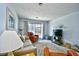 Comfortable living room with modern decor, a plush rug, and a sliding glass door to a balcony at 9621 Shore Dr. # F-117, Myrtle Beach, SC 29572