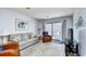 Bright and inviting living room with comfortable seating, a view of the balcony, and stylish decor at 9621 Shore Dr. # F-117, Myrtle Beach, SC 29572