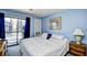 Comfortable main bedroom with balcony access and serene decor at 9621 Shore Dr. # F-117, Myrtle Beach, SC 29572