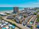 Beautiful aerial view of condos near the beach, featuring pools and lush landscaping at 9661 Shore Dr. # B-3, Myrtle Beach, SC 29572