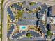 Aerial view of condo complex featuring a swimming pool, parking, and well-maintained landscaping at 9661 Shore Dr. # B-3, Myrtle Beach, SC 29572