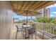 Inviting balcony with seating, umbrella, and views of the neighborhood at 9661 Shore Dr. # B-3, Myrtle Beach, SC 29572