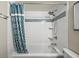 Bright bathroom featuring a shower-tub with white subway tile and updated fixtures at 9661 Shore Dr. # B-3, Myrtle Beach, SC 29572