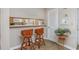 Charming kitchen area with breakfast bar, seating, and a view into the adjacent living spaces at 9661 Shore Dr. # B-3, Myrtle Beach, SC 29572