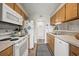 Functional kitchen with white appliances, ample cabinet space, and a convenient layout for meal preparation at 9661 Shore Dr. # B-3, Myrtle Beach, SC 29572
