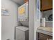 Stackable washer and dryer in a dedicated laundry area, offering convenience and efficiency at 9661 Shore Dr. # B-3, Myrtle Beach, SC 29572