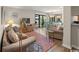 Cozy living room with comfortable seating, stylish decor, and a sliding glass door to a balcony with a view at 9661 Shore Dr. # B-3, Myrtle Beach, SC 29572
