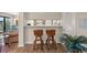 Stylish interior view with barstool seating, connecting seamlessly to the dining area and an inviting balcony at 9661 Shore Dr. # B-3, Myrtle Beach, SC 29572