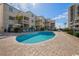 Inviting outdoor pool area with lounge chairs and a nearby high-rise building at 9661 Shore Dr. # B-3, Myrtle Beach, SC 29572