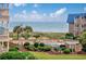 Community pool with lush landscaping and ocean views at 9661 Shore Dr. # B-3, Myrtle Beach, SC 29572