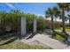 Convenient outdoor shower area surrounded by lush greenery and palm trees at 9661 Shore Dr. # B-3, Myrtle Beach, SC 29572
