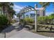 Picturesque walking path with shaded pergola and seating amidst lush landscaping at 9661 Shore Dr. # B-3, Myrtle Beach, SC 29572