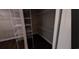 Walk-in closet featuring ample shelving and dark hardwood flooring at Tbd 81 Persimmon Rd., Aynor, SC 29511
