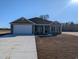 Charming single-story home with a two-car garage and well-manicured lawn at Tbd 81 Persimmon Rd., Aynor, SC 29511