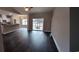 Spacious living room featuring sleek, dark wood flooring and large sliding glass doors at Tbd 81 Persimmon Rd., Aynor, SC 29511