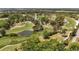 Beautiful aerial view showcasing a sprawling golf course community with lush landscaping and serene ponds at 1100 Possum Trot Rd. # B102, North Myrtle Beach, SC 29582