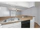 Kitchen view with breakfast bar that opens up to living space at 1100 Possum Trot Rd. # B102, North Myrtle Beach, SC 29582