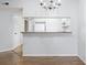 Bright kitchen with white cabinets, breakfast bar, and modern appliances at 1100 Possum Trot Rd. # B102, North Myrtle Beach, SC 29582