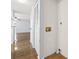 Laundry area with closet and hookups for washer and dryer; situated off hardwood hallway at 1100 Possum Trot Rd. # B102, North Myrtle Beach, SC 29582