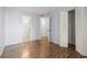 Bedroom with hardwood floors, closet, and attached bathroom at 1100 Possum Trot Rd. # B102, North Myrtle Beach, SC 29582