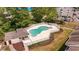Aerial view of the private community pool surrounded by a white picket fence and sunbathing area at 1100 Possum Trot Rd. # B102, North Myrtle Beach, SC 29582