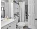 Bathroom with a vanity, toilet, cabinet, and shower with tiled surround at 1100 Possum Trot Rd. # D-205, North Myrtle Beach, SC 29582